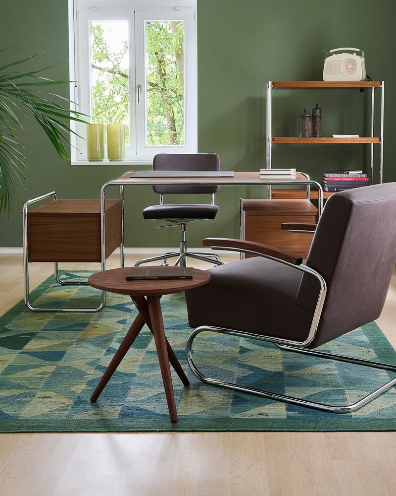 Modern interior with stylish S 285 Desk by Thonet and a geometric rug.