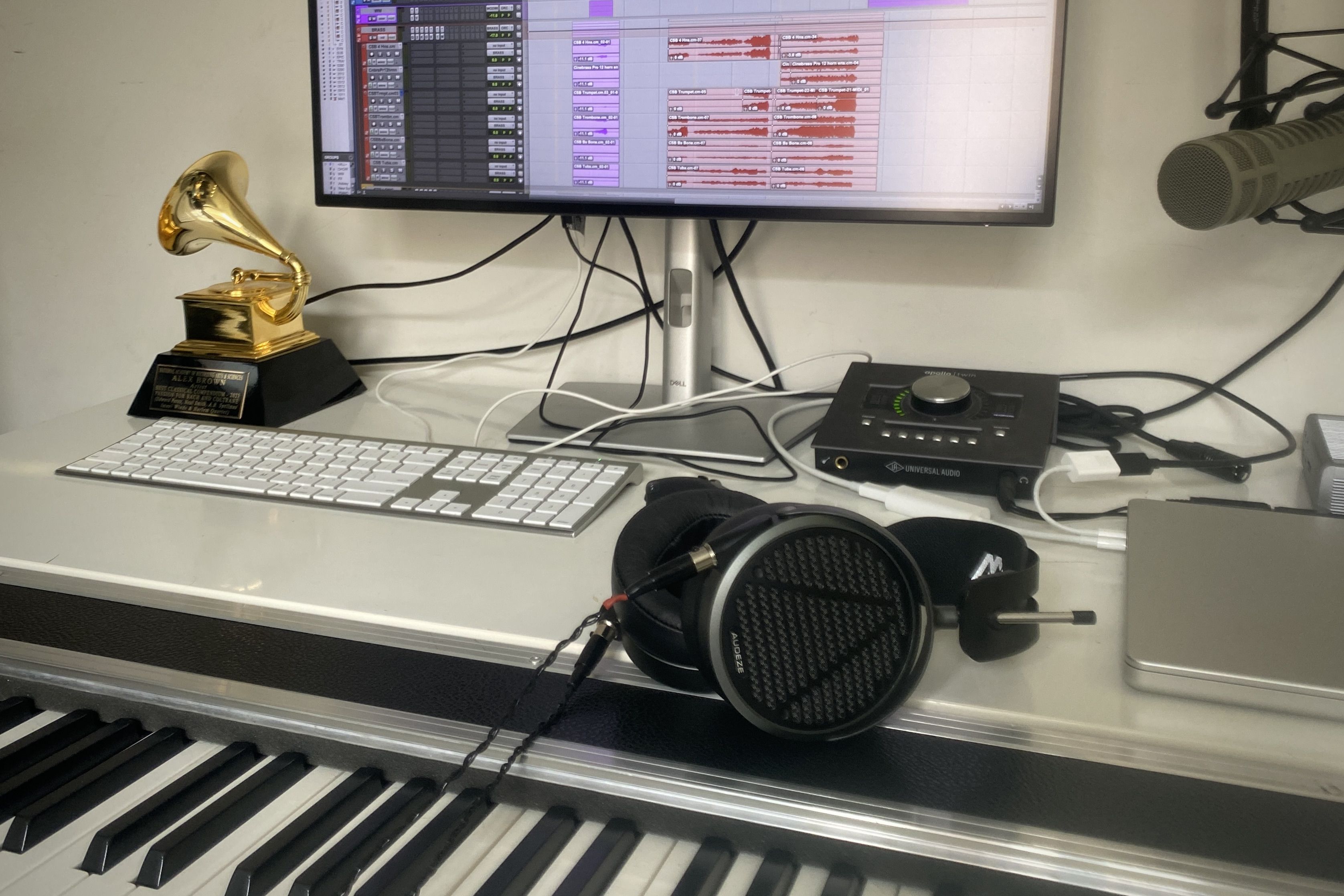 Audeze MM-500 laying on studio table with a Grammy 