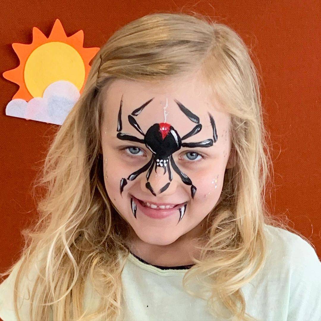 cute face paint girl redback spider design