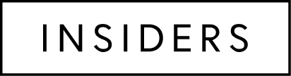 A simple black silhouette of a house with a chimney.