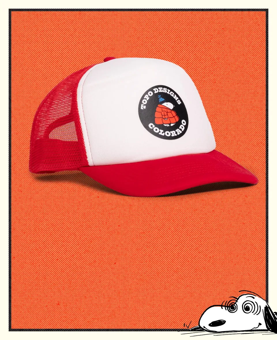 Red and white trucker cap with a circular logo.