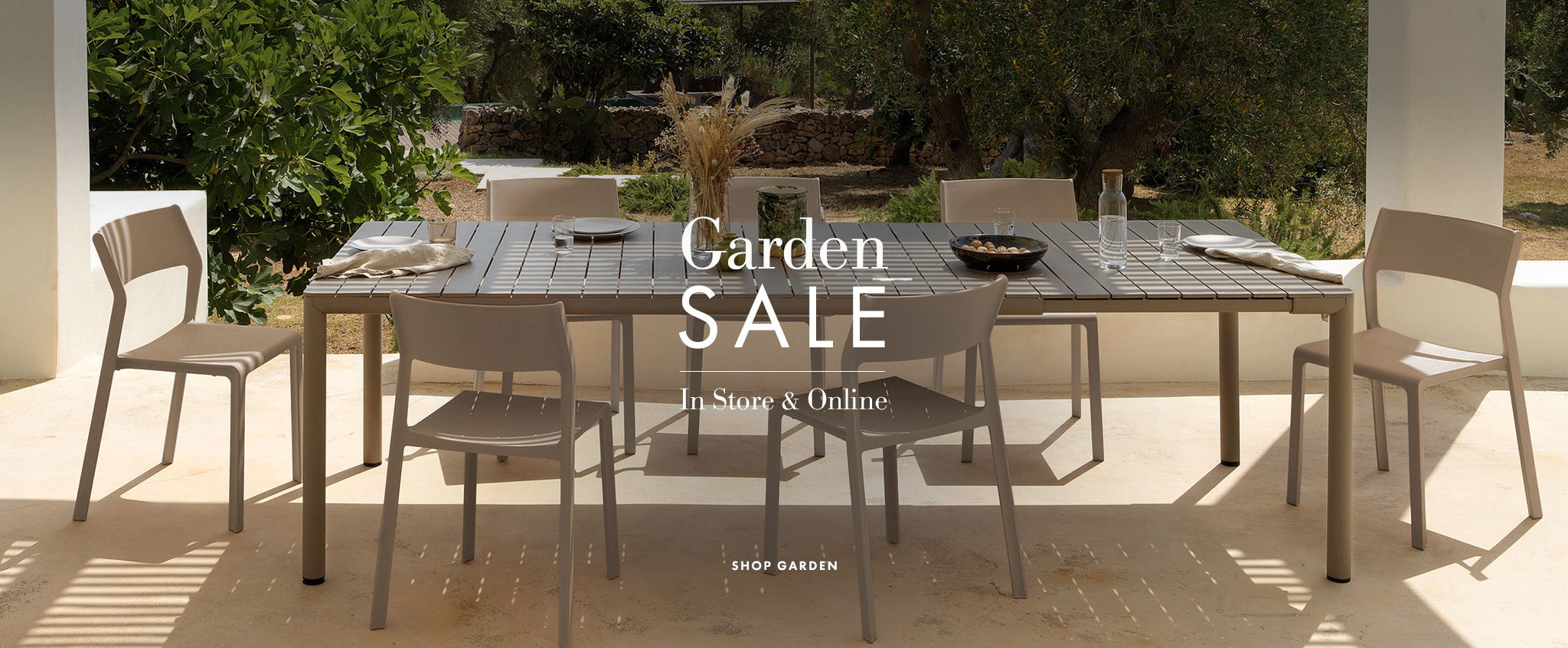 Nardi garden furniture sale now on banner, featuring outdoor dining table and chairs