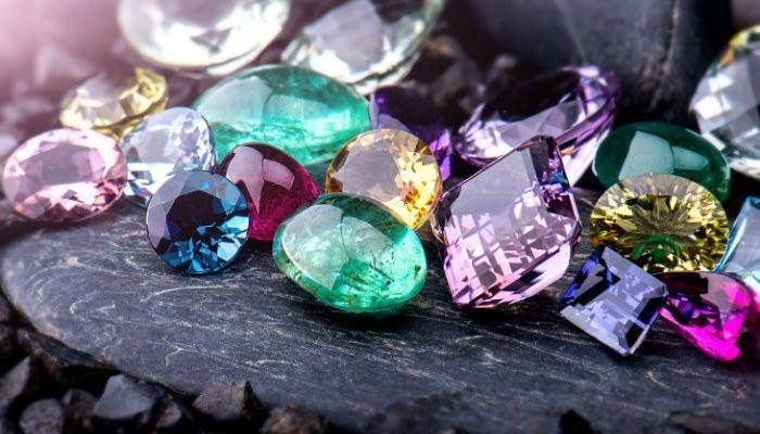 Assorted gemstones on a rock