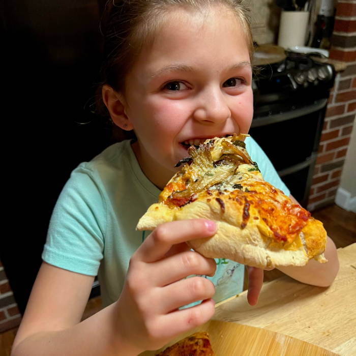 kids enjoying their homemade mushroom pizza