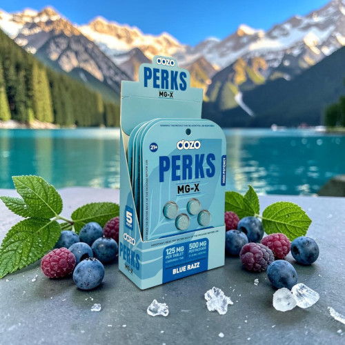 Box of Perks mints surrounded by berries and mint leaves by a lake.