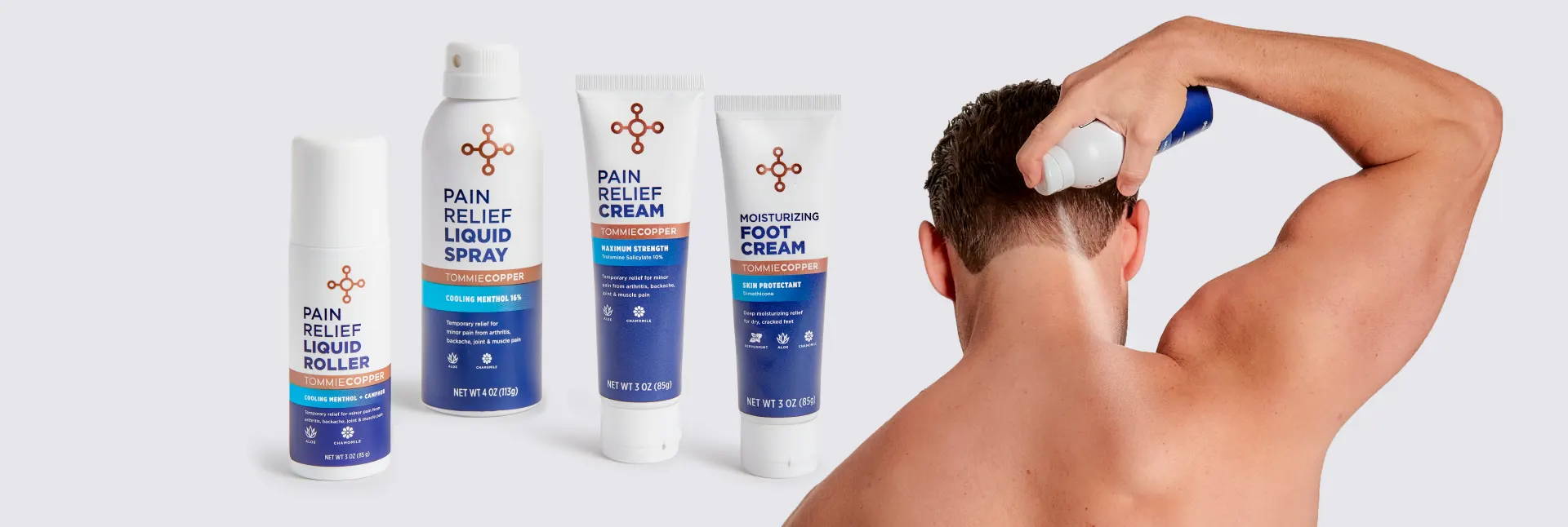 Assorted Tommie Copper® Pain Relief products beside a man applying Pain Relief Liquid Spray to his upper back