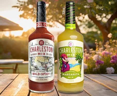 Two bottles of Charleston Mix in a garden setting.