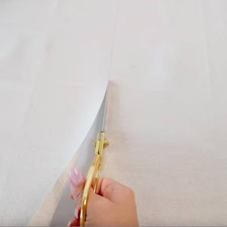 Cutting outer fabric into a 28-inch square for the flower bag