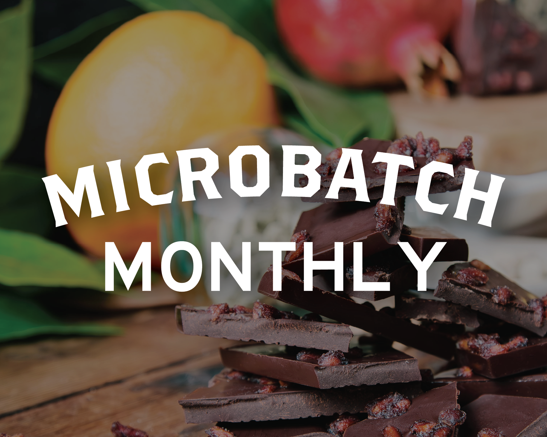 Microbatch monthly logo with stack of pomegranate dark chocolate in front of orange and cardamom 