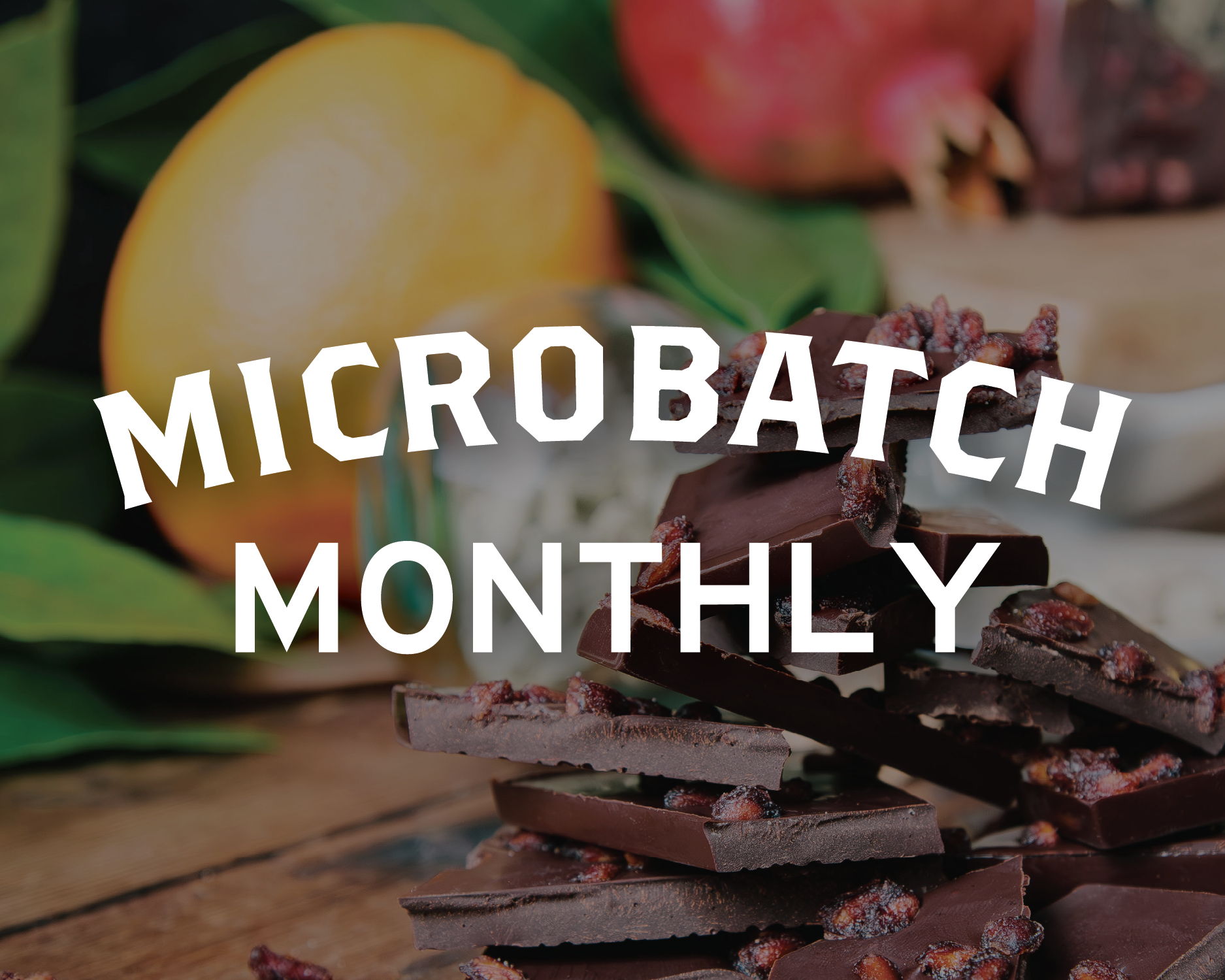 Microbatch monthly logo with stack of pomegranate dark chocolate in front of orange and cardamom 