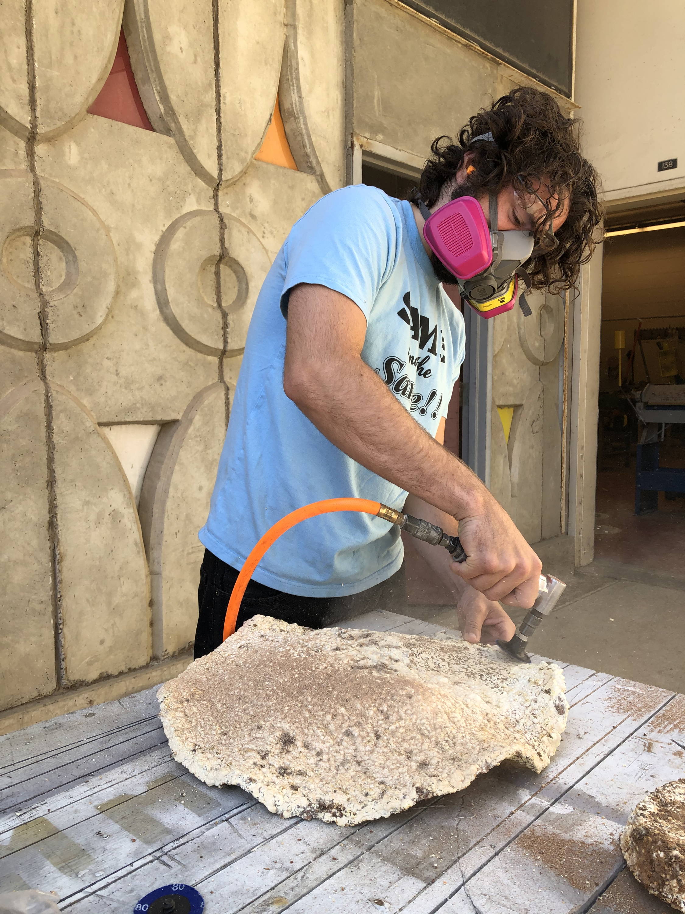 finishing the mycelium shell with pneumatic sander