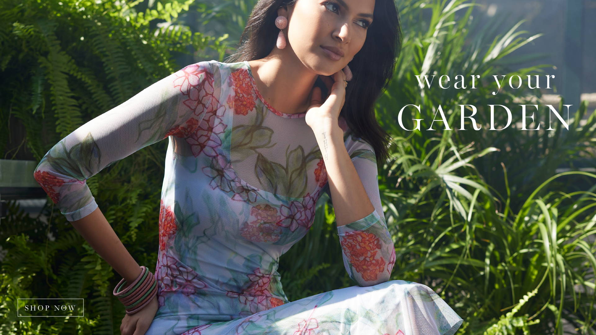 Wear your Garden | Shop Now | Woman wearing floral printed mesh dress topper over short knit dress 