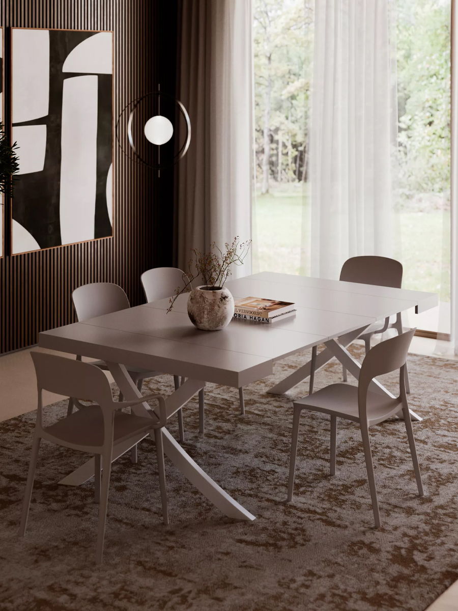 A modern Artistico console/dining table, with chairs, and large windows.