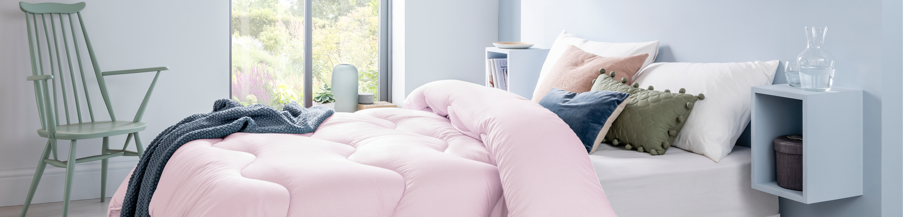 A coverless Night Owl duvet in the colour dusk pink on double bed in a Scandinavian style bedroom