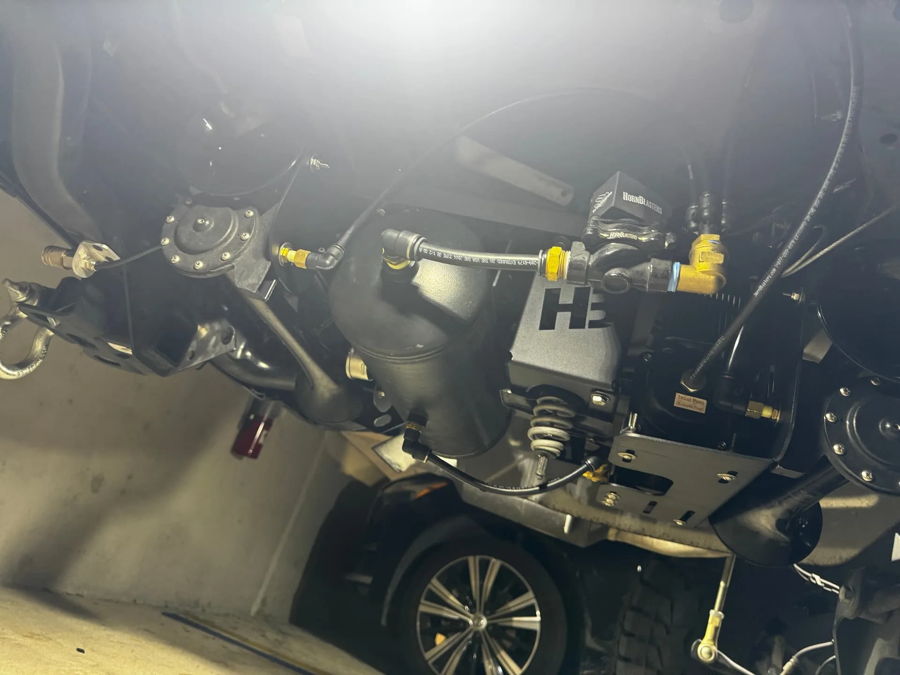 Spare tire delete bay underside Stephen's Gladiator black Stealth train horn bells compact manifold air tank rear axle off-road tires photo 4