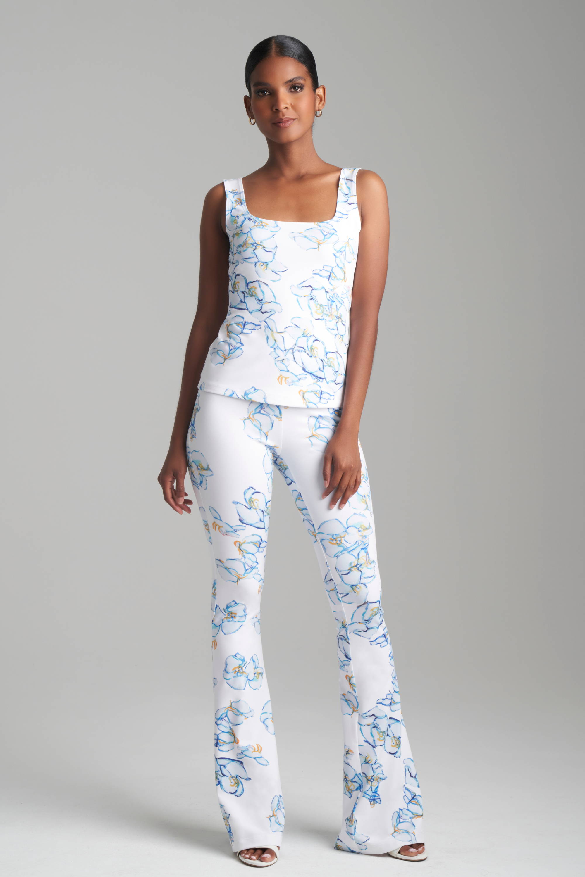 Woman wearing matching floral printed tank top and pants by Ala von Auersperg for spring 2024