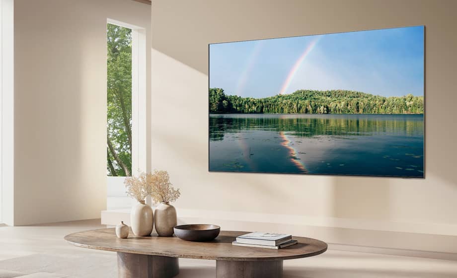 Modern living room with a TV displaying a serene landscape over water.