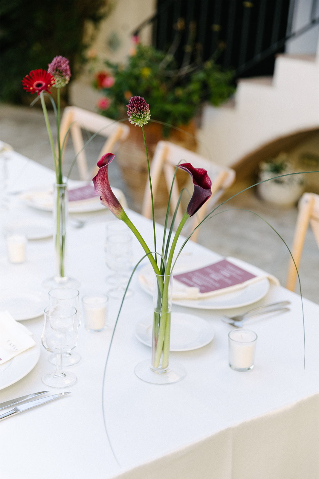Elegant dining table set with flowers and candles.