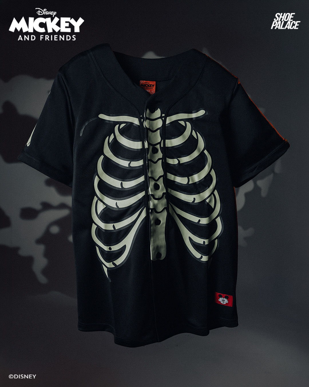 Black t-shirt with skeleton ribcage graphic, featuring Mickey Mouse design.