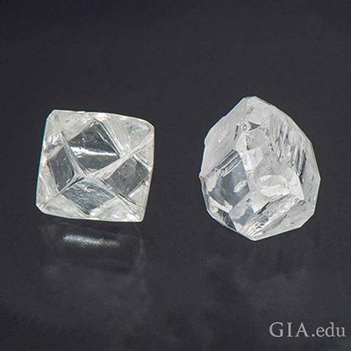 A raw earth-mined or natural diamond versus a raw HPHT diamond.
