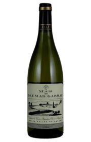 Bottle of white wine with a label featuring a vineyard illustration.