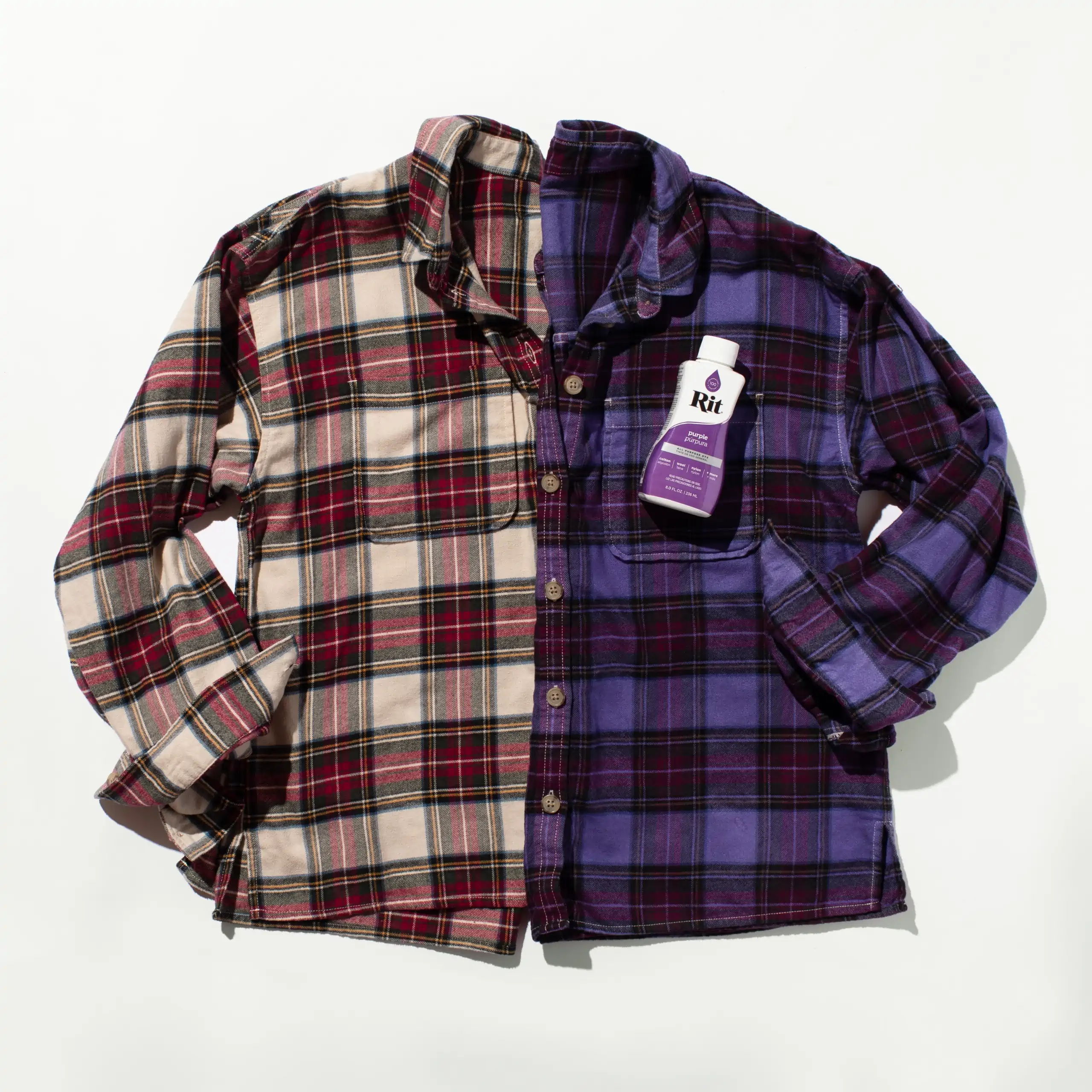Two-tone plaid shirt in red and purple with a tag.