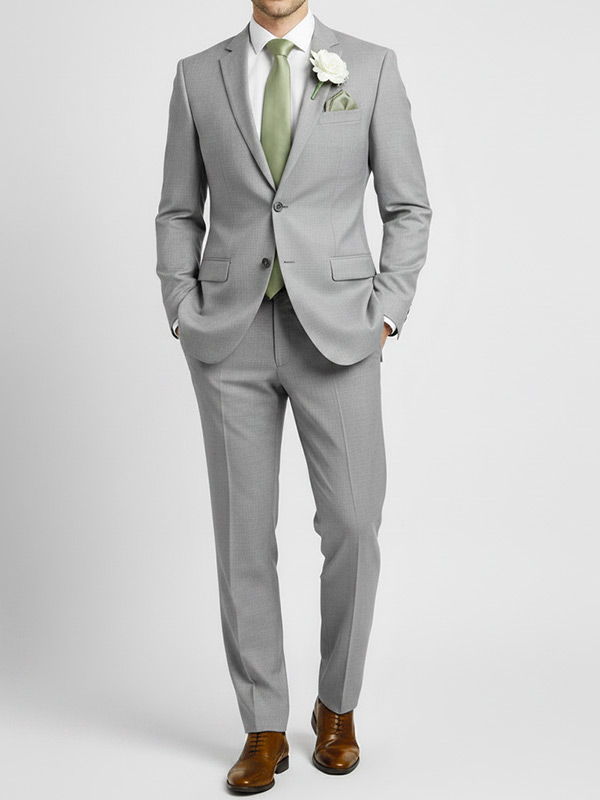 Groomsman wearing a sage wedding tie and gray suit