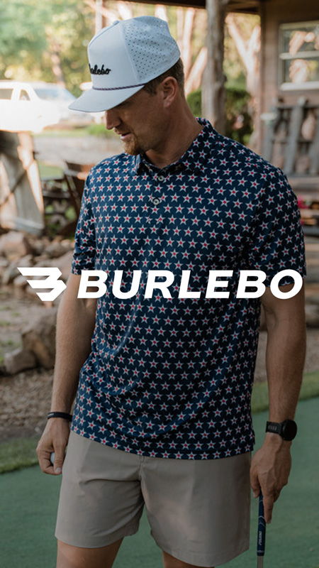 Man in a patterned shirt and cap, holding a golf club.