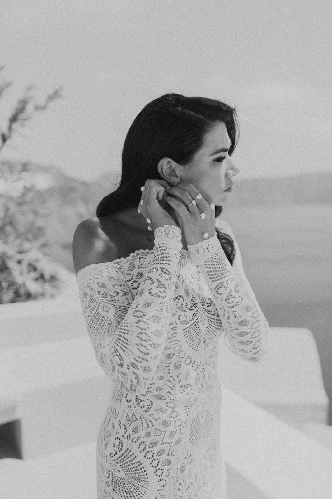 Black and White image of Bride with Accessories and Grace Loves Lace gown