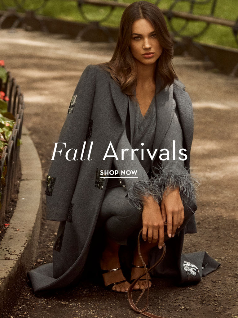 Model showcasing fall fashion in a park setting, with text overlay.