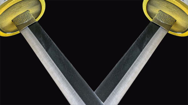 Two crossed swords with yellow handles against a black background.