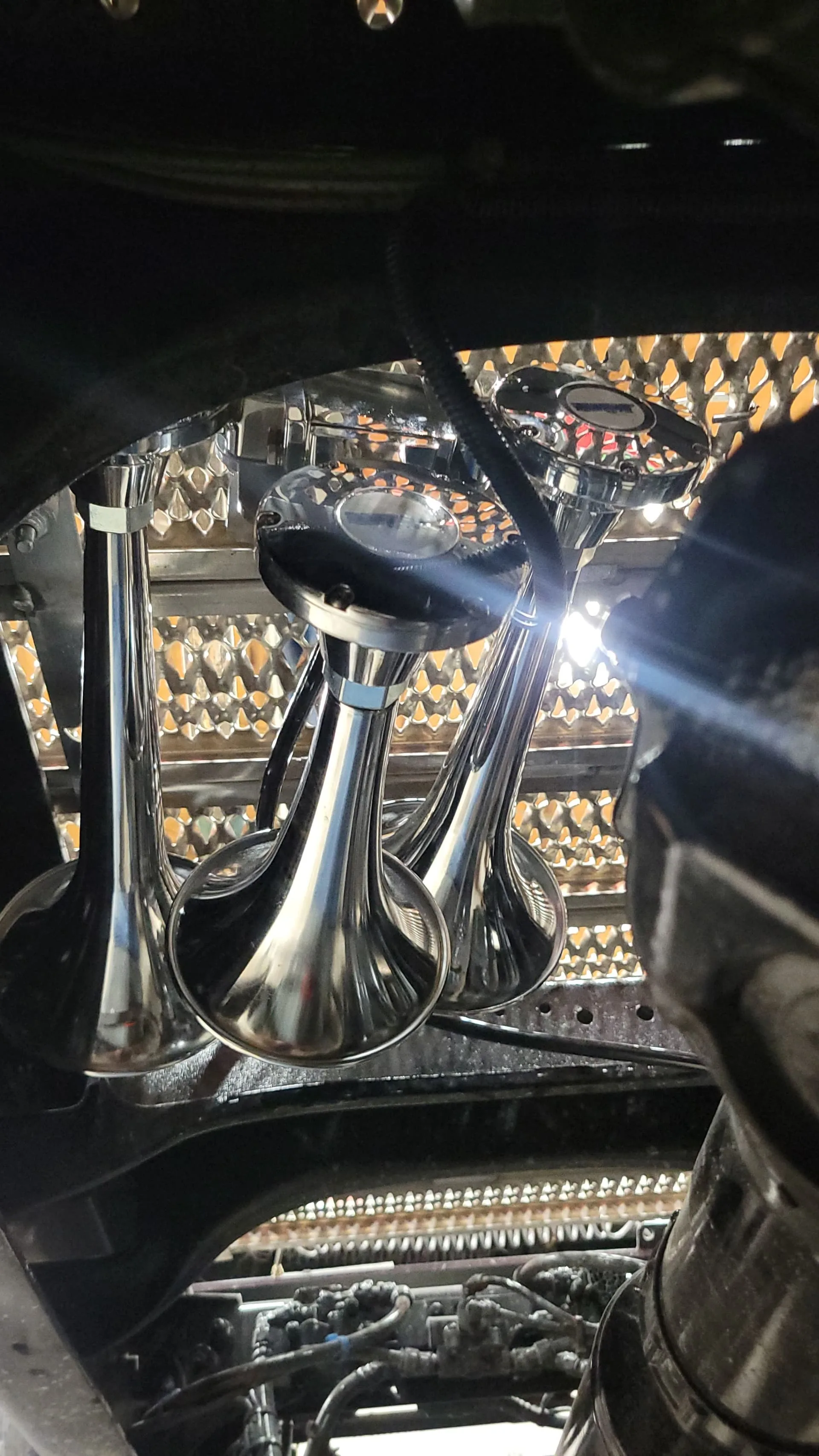 Close-up of Outlaw chrome train horn bells mounted on 2025 Peterbilt 579 HornBlasters gallery photo 3