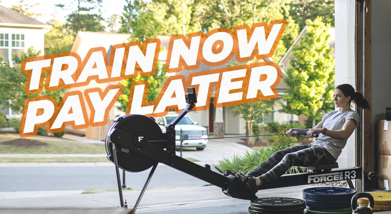 Home gym with equipment and 'TRAIN NOW PAY LATER' offer highlighted, featuring a focused woman using a rowing machine in a garage setting.