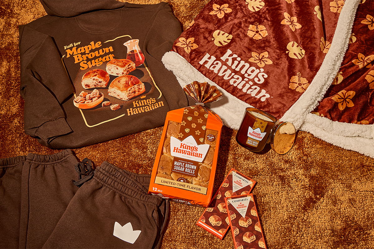King's Hawaiian Maple Brown Sugar Merch Collection laid out on an amber background: a brown 