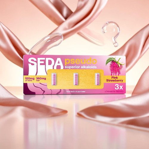 Seda hair treatment packaging with pink ribbons in a soft background.