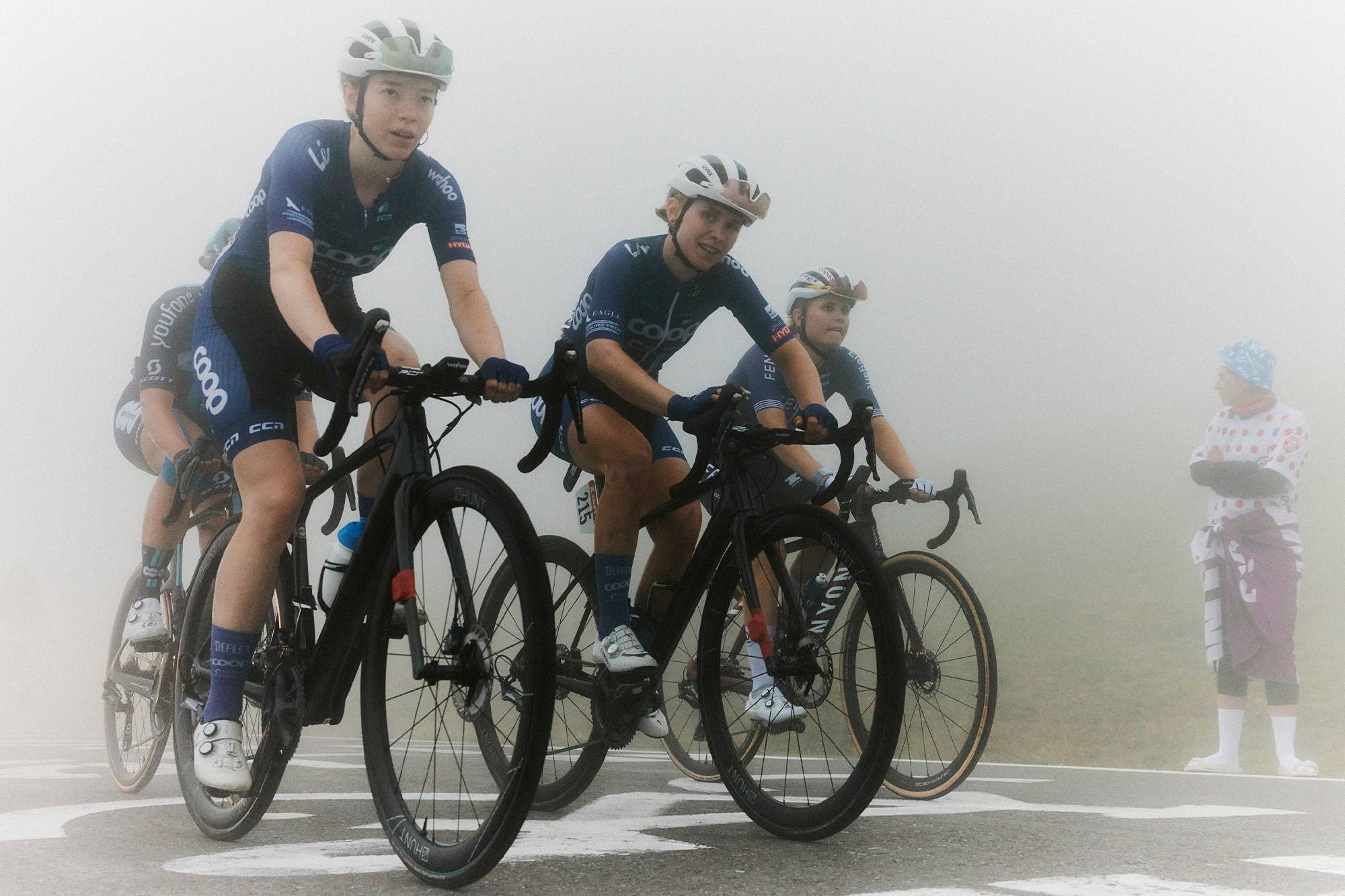 Josie and Tiril riding up the Tourmalet in the fog