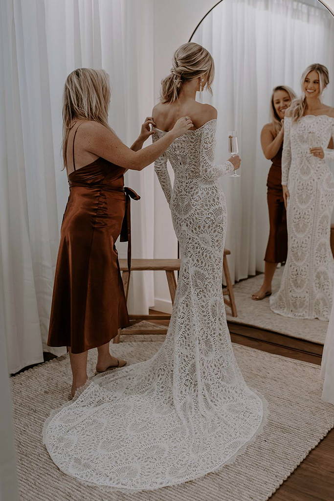 Stylist with Bride in Grace Loves Lace Showroom