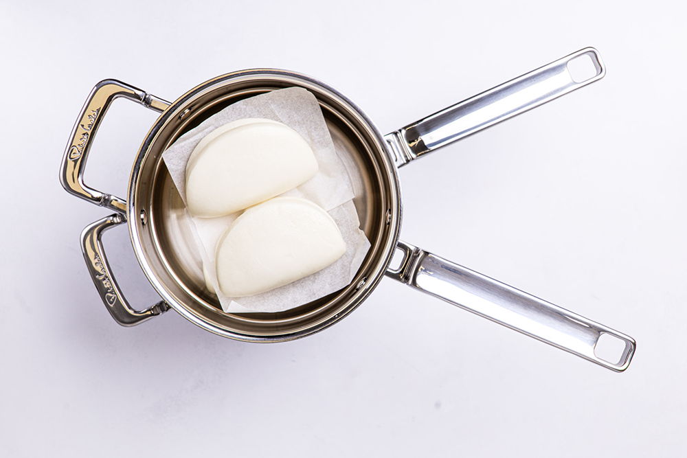 316 Series 18cm Steamer with two bao buns inside.