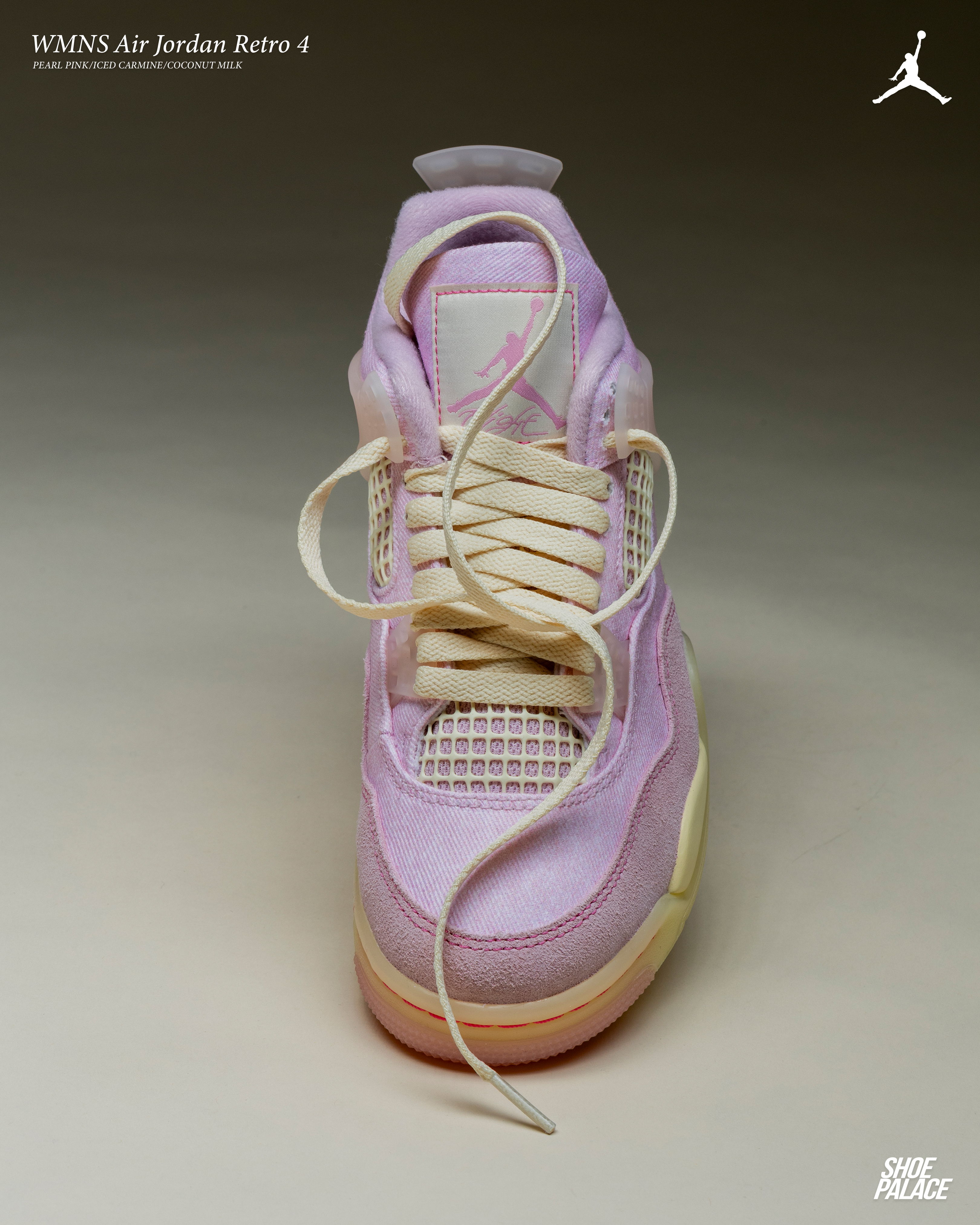 A pink and cream sneaker with laces, facing forward.