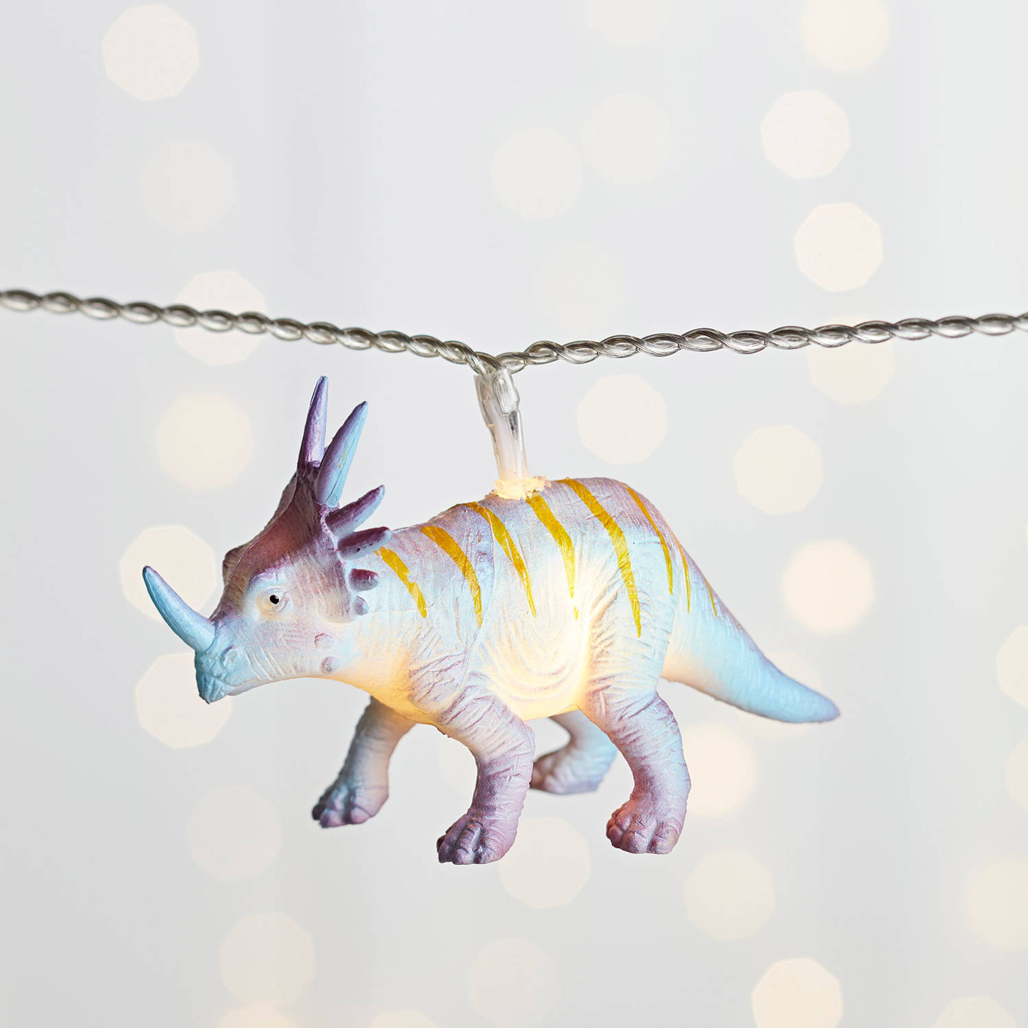 close up of multicoloured dinosaur fairy lights