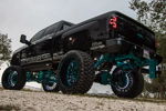 Low rear three-quarter view of black lifted Silverado 2500 thumbnail