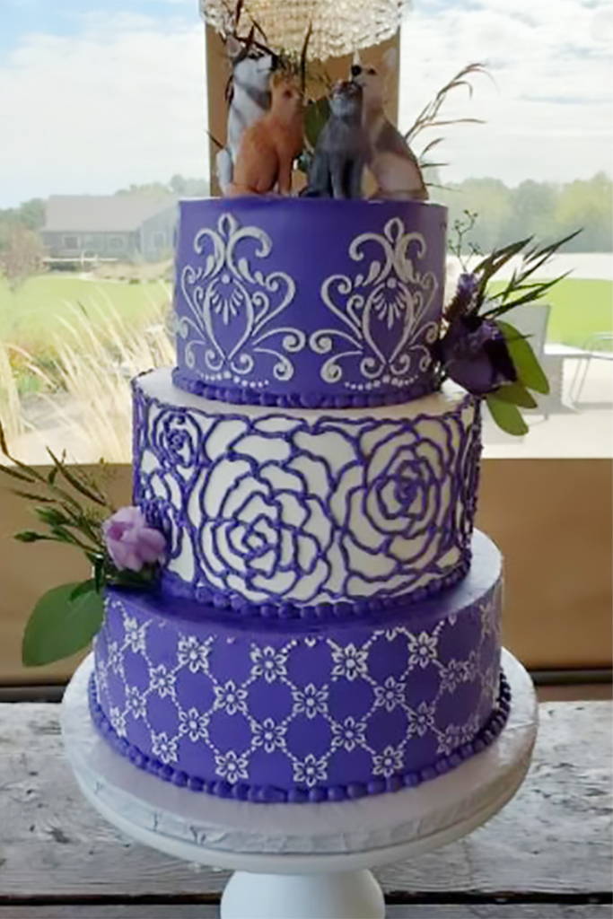 Three layer cake with purple fondant