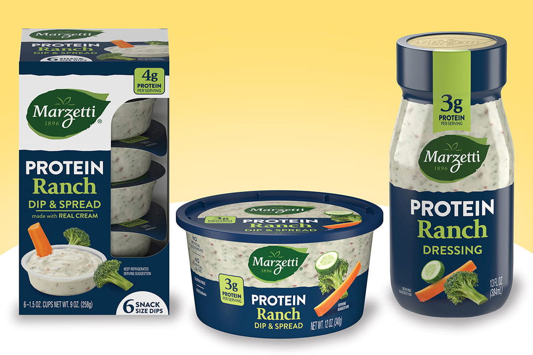 Three containers of protein ranch dip, dressing, and seasoning on a yellow background.