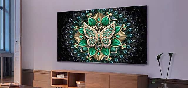 A butterfly design displayed on a wall-mounted TV in a modern room.