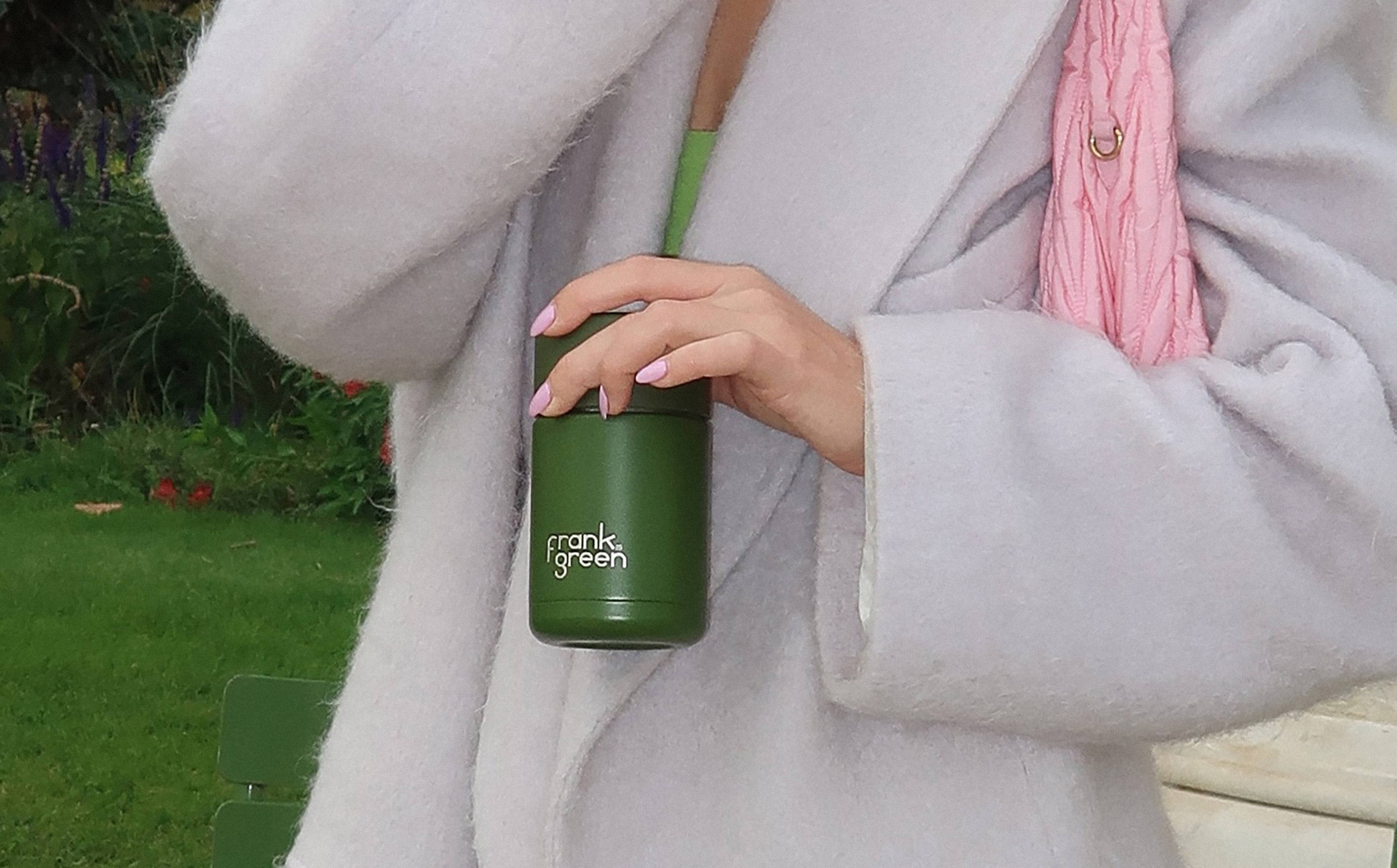 Violet Grace holding a 10oz / 295ml Ceramic Reusable Cup in Khaki 