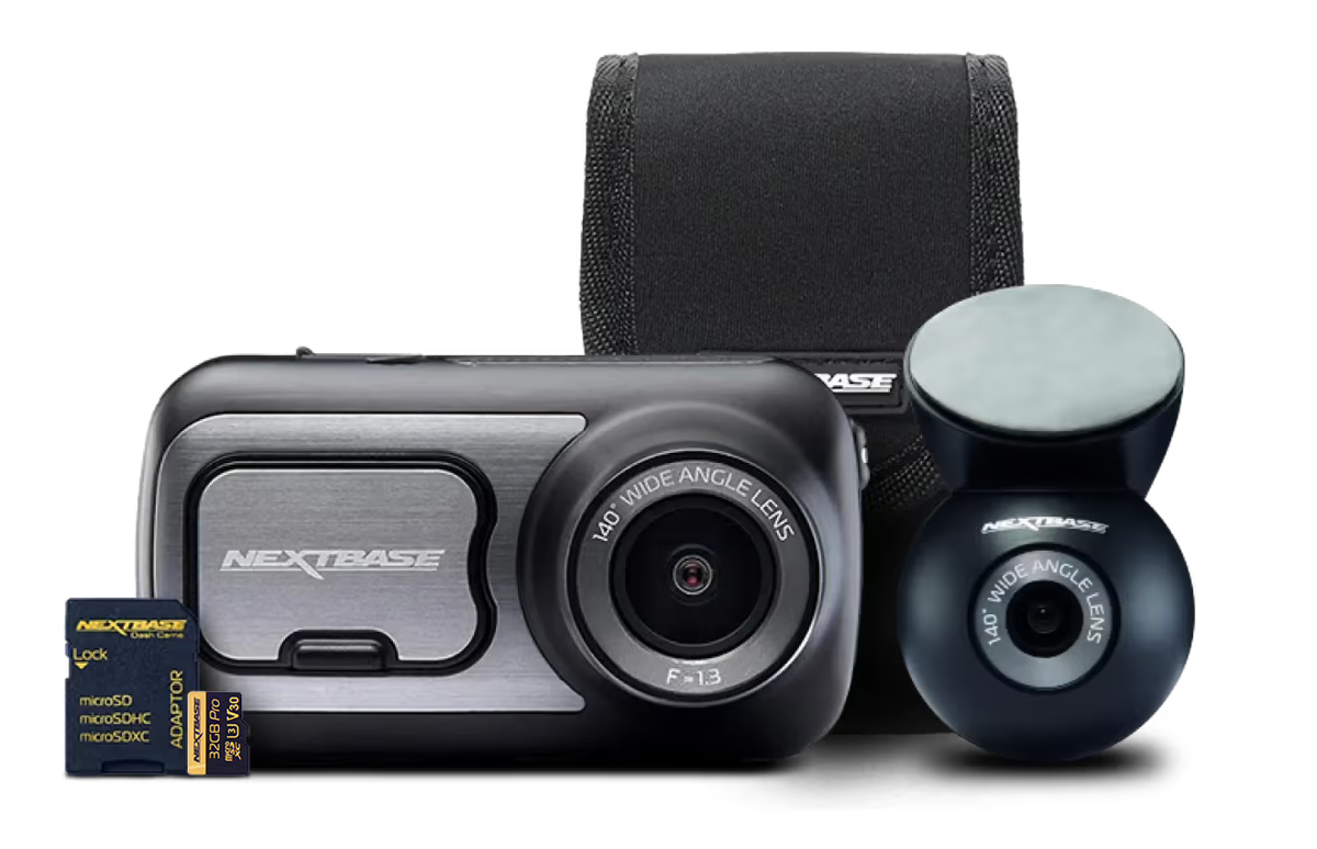Dashboard camera with lens, memory card, and protective case.