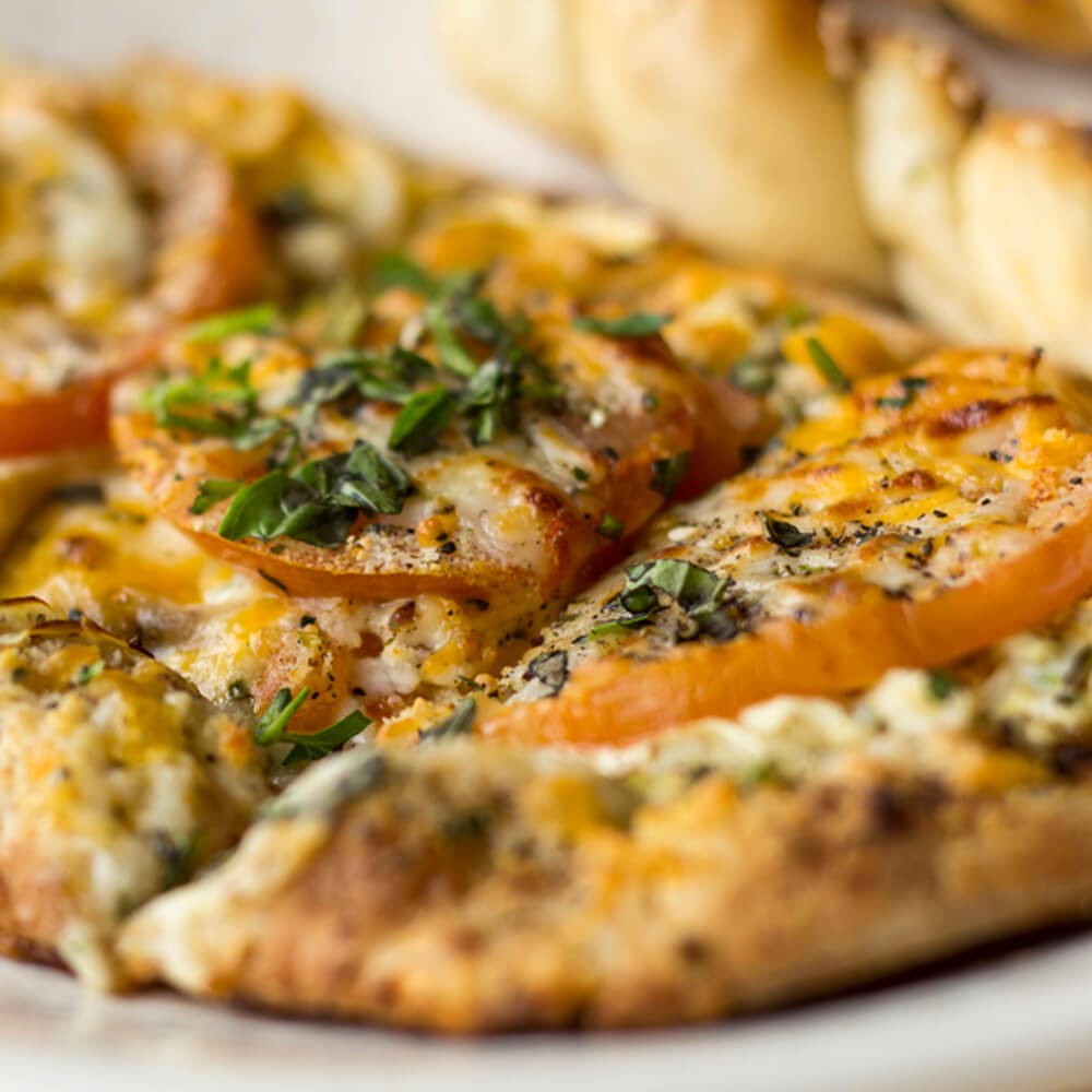 tomato on flatbread with cheese