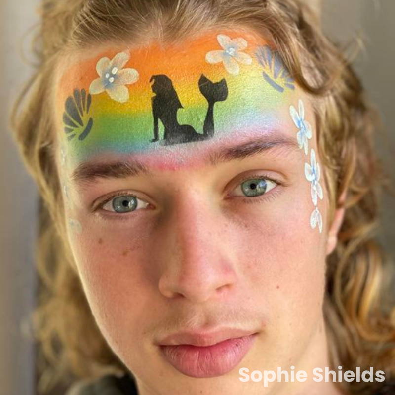 mermaid face paint design with stencil and rainbow