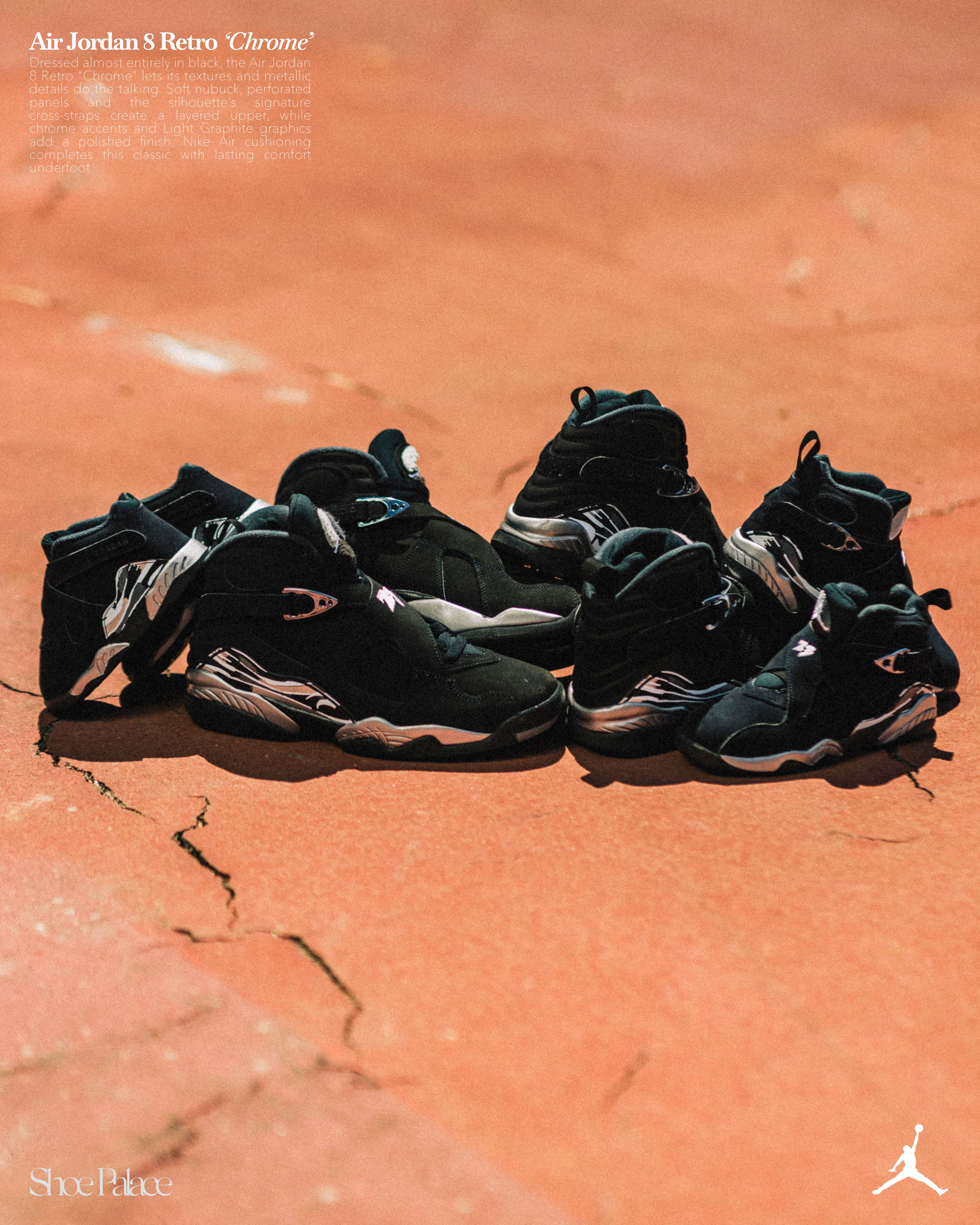 A collection of black Air Jordan sneakers on a rough surface.