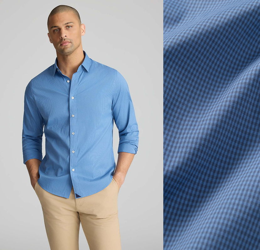 Man wearing a blue button-up shirt with a close-up of the fabric.